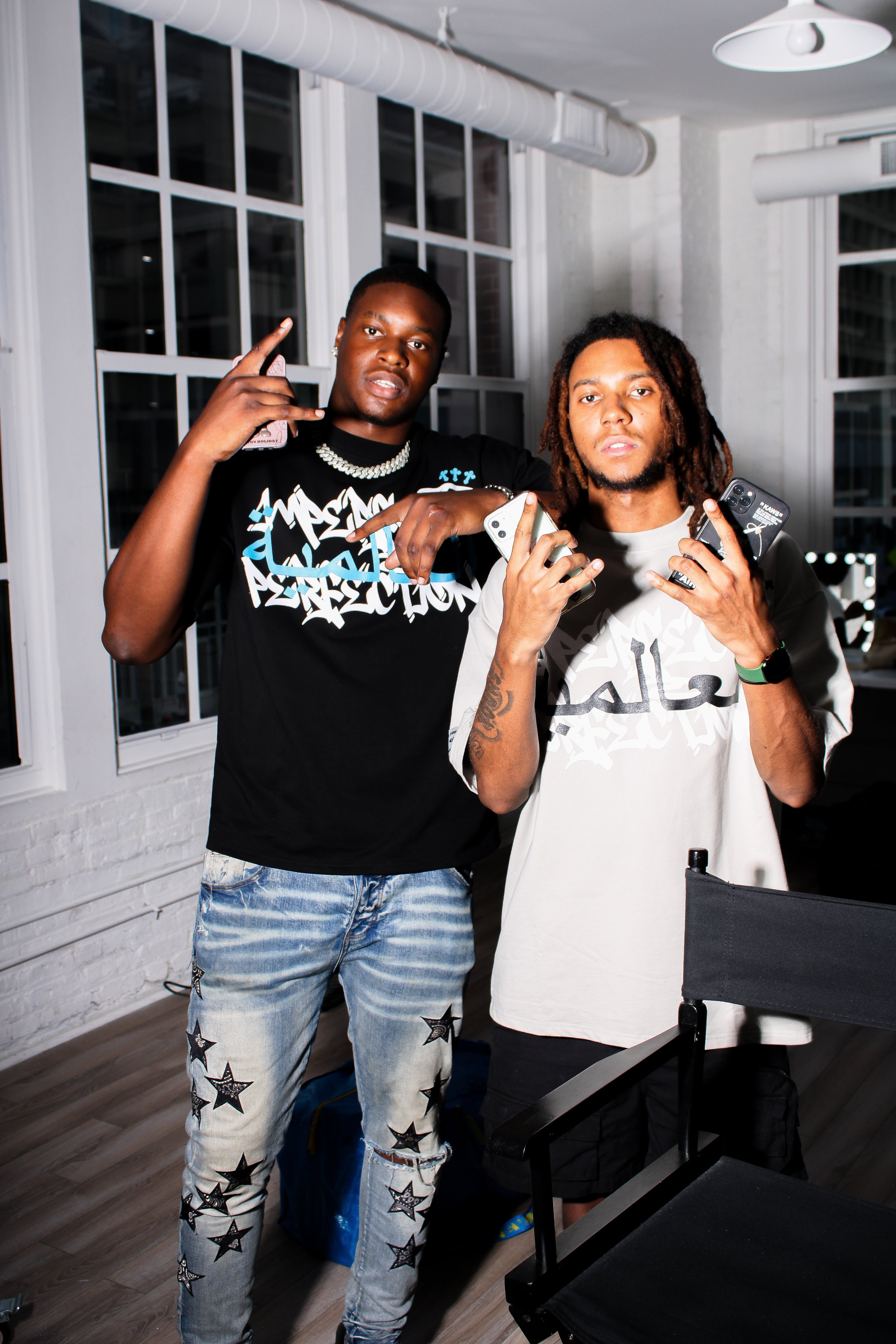 Models showcasing the W.ORLD* Arabic Tee from the Imperfect Perfection collection.