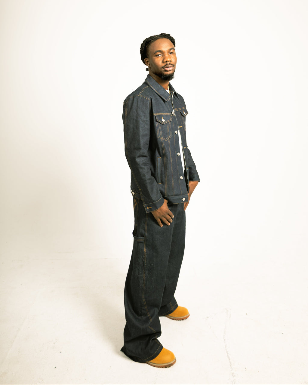 Man wearing a denim outfit on a white background